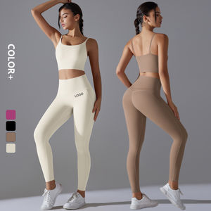 Venta al por mayor de logotipo personalizado sin costuras sólido elástico Yoga conjunto sujetador Legging correr de dos piezas gimnasio Fitness conjuntos ropa para mujer - Product Image 1