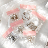 Sacs de rangement pour bijoux en EVA rose de luxe en stock, pochettes refermables en EVA transparent épaissi avec fermeture éclair pour l'emballage de bagues, boucles d'oreilles et bracelets