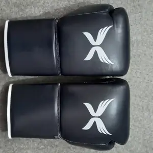 Zugband echte Leder Boxhandschuhe Training Kuhfell Gewinnhandschuhe für Kick Boxing professioneller Gebrauch Praxishandschuhe