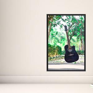 Affiche élégante sur toile imprimée : illustration d'un guitariste pour les amateurs de musique moderne, encadrée en noir. - Product Image 1