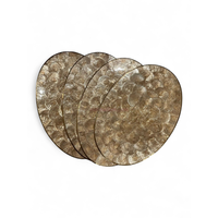 Set de table ovale moderne en coquillages naturels, fabriqué au Vietnam, pour la présentation quotidienne de la table et la décoration intérieure.
