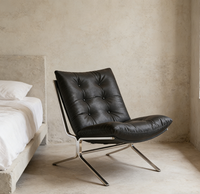 Fauteuil de salon individuel, style Bauhaus, minimaliste et luxueux, avec structure métallique et dossier en cuir