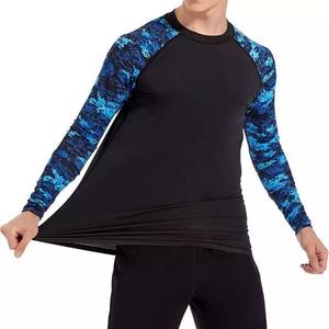 เสื้อแรชการ์ดแขนยาวสำหรับผู้ชาย ป้องกันรังสียูวี UPF50+ ผลิตจากผ้าฝ้ายโพลีเอสเตอร์ 100% สำหรับออกกำลังกาย ฟิตเนส คอเสื้อทรงเข้ารูป แห้งเร็ว ระบายอากาศได้ดี - Product Image 3