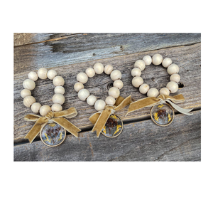 แหวนผ้าเช็ดปากลูกปัดไม้สำหรับตกแต่งโต๊ะพร้อมเชือกประดับพู่ - Product Image 1