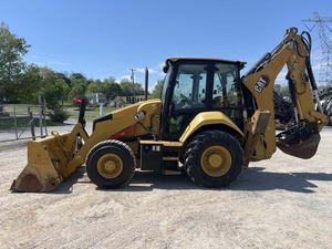 Chargeuse-pelleteuse Cat 430 avec godet avant et bras de terrassement arrière, équipement de construction jaune - Product Image 3