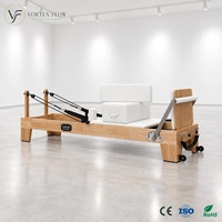 Vente en gros : Équipement de Pilates Reformer en chêne massif, avec barre de repose-pieds à sept positions et appui-tête réglable, pour studio de fitness