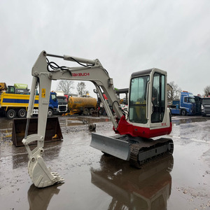 Excavadora compacta (mini) Takeuchi TB150C de 5 toneladas, lista para enviar (RTS), con cabina, orugas de goma, cuchilla angular y cucharón 24. - Product Image 1
