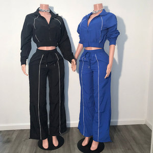 Ensemble deux pièces tendance pour femme : veste courte zippée à manches longues et pantalon ample, survêtement en nylon personnalisable avec logo – Nouveauté fabricant - Product Image 1