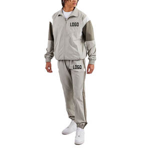 ชุดวอร์ม2ชิ้นผ้าไนลอนโพลีเอสเตอร์แบบรูดซิปขนาดใหญ่ชุดวิ่งออกกำลังกายกันลมสำหรับฤดูใบไม้ผลิออกแบบโลโก้ได้ตามต้องการ - Product Image 1