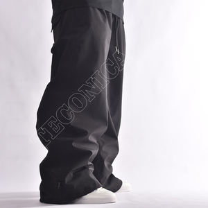 Pantalon de neige imperméable noir unisexe OEM avec doublure polaire chaude à la taille et protection imperméable pour l'hiver - Product Image 4