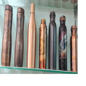 custom made copper bottles in an assortment of sizes and shapes ideal for use by holistics supplies stores