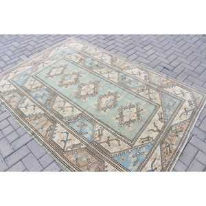 Tapis vintage 5,2 x 7,4 pieds, tapis turc, tapis floral bleu et marron - Product Image 4