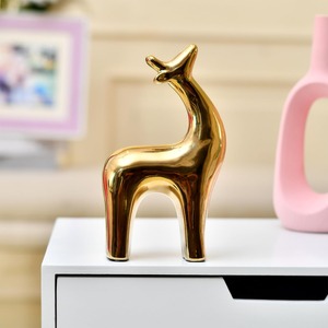 รูปปั้นกวางเรนเดียร์สีทองที่สง่างามของตกแต่งโต๊ะตามเทศกาลเหมาะสำหรับการตกแต่งบ้านการตั้งค่ากิจกรรมคริสต์มาสหรือการตกแต่งสำนักงาน - Product Image 1