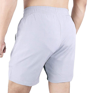 Pantalones cortos de compresión para la playa para hombre baratos al por mayor, pantalones cortos lisos de secado rápido de talla grande para gimnasio, pantalones cortos de entrenamiento físico con bolsillos para hombre - Product Image 2