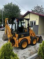 Mini-pelleteuse JCB 1CX à accès étroit 2025 |   Chargeuse sur pneus à largeur réduite |   Chargeuse-pelleteuse pour travaux urbains et aménagement paysager