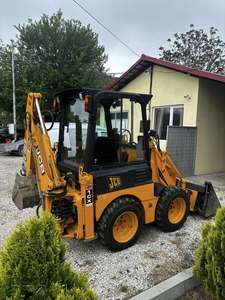 Mini-pelleteuse JCB 1CX à accès étroit 2025 |   Chargeuse sur pneus à largeur réduite |   Chargeuse-pelleteuse pour travaux urbains et aménagement paysager - Product Image 2