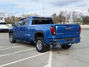 Super Blue 2024 GMC Sierra 1500 AT4 Crew Cab 4WD Techo Panorámico Arranque Remoto Asientos de Cuero Paquete Premium Cromado Izquierdo Oscuro - Product Image 3