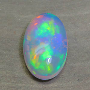 Precioso cabujón de ópalo etíope natural, sombra azul, arcoíris, forma ovalada llamativa, piedra preciosa de grado A.A.A - Product Image 3