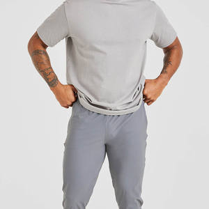Joggers de tela elástica transpirables ajustados grises de alta calidad para hombre para cintura elástica de hombre y detalles de cremallera en el puño - Product Image 5