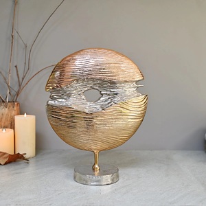 Aluminum sculpture with dynamic shape and handcrafted texture for modern homes and public <b>spaces</b> - Product Image 1