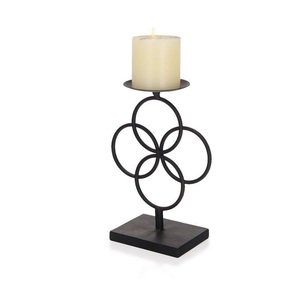 Handcrafted metal candle tealight holder designed to cast soothing warm <b>light</b> and enrich times around the home - Product Image 1