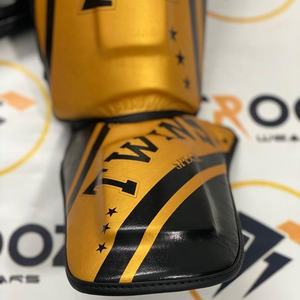 Protèges-tibias professionnels en cuir véritable pour Muay Thai et MMA avec logo personnalisé et fermeture à boucle - Product Image 2