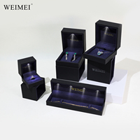 WEIMEI Boîte à bijoux LED noire de luxe Boîte à bijoux LED estampage en or Boîte à bagues personnalisée Boîte à bijoux avec lumières