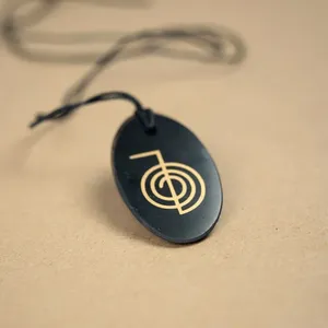 Colgante pulido ovalado de corte Shungite con serigrafía Cho Ku Rei 1,3*2 in (34*50mm) - Product Image 2