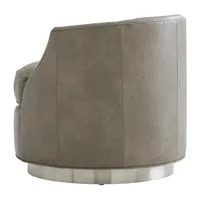 Fauteuil pivotant de luxe avec revêtement en cuir souple et base en métal brossé, dossier capitonné pour les intérieurs modernes et glamour