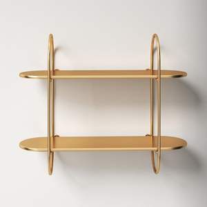 Estantes artísticos de latón dorado creados con artesanía detallada, perfectos para soluciones de almacenamiento de alta gama - Product Image 6