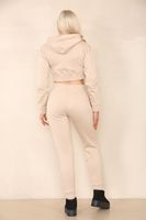 Ensemble élégant d'hiver pour femme : crop top uni et pantalon long, tendance, deux pièces, streetwear décontracté avec détails boutonnés, tissu respirant