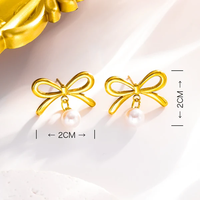 En gros Petit Tempérament Frais Noeud Papillon Perle Artificielle Boucles D'oreilles et Collier pour Femmes Bijoux De Mode Coréenne