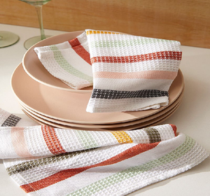 Modern multi-colored striped cotton towel draped on a woven wooden chair. Available at wholesale prices. - Product Image 3