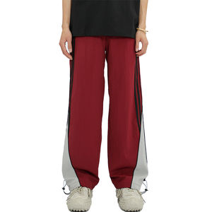 Vente en gros Pantalon en nylon pour homme Pantalon de survêtement coupe-vent en nylon personnalisé Pantalon de survêtement patchwork en nylon à rayures latérales Pantalon pour homme - Product Image 1