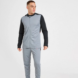 Survêtement gris et noir pour homme avec blocs de couleur, fermeture éclair intégrale, poches latérales, design sportif respirant, idéal pour l'automne - Product Image 1