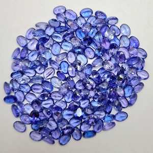 Piedras preciosas facetadas de corte ovalado de tanzanita Natural de alta calidad, suministro directo de fábrica, lote de piedras preciosas sueltas a granel al por mayor - Product Image 1