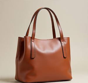 2025 recién llegado, bolso de cubo de cuero genuino de lujo para mujer, bolso de mano marrón personalizado con cierre de cremallera - Product Image 1