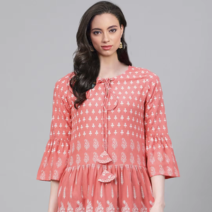 Peach floral printed rayon short kurti for women and girls with keyhole neck & <b>bell</b> <b>sleeves</b> designed for comfortable daily wear - Product Image 1