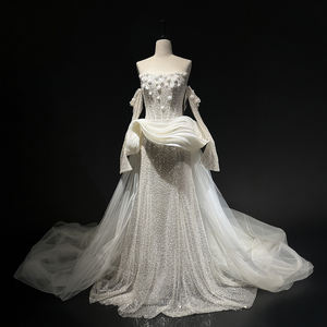 Robe de mariée sirène moderne et brillante NT97 à col bateau et volants, avec traîne chapelle, jupe longue, fleurs, cristaux et dentelle - Product Image 1