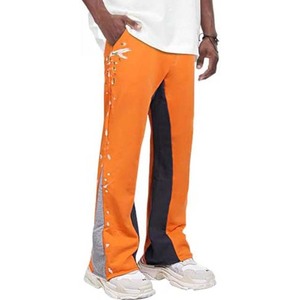 Pantalones acampanados de retales para hombre, moda personalizada, de talla grande, holgados, con salpicaduras de tinta, rectos, a rayas curvas - Product Image 1