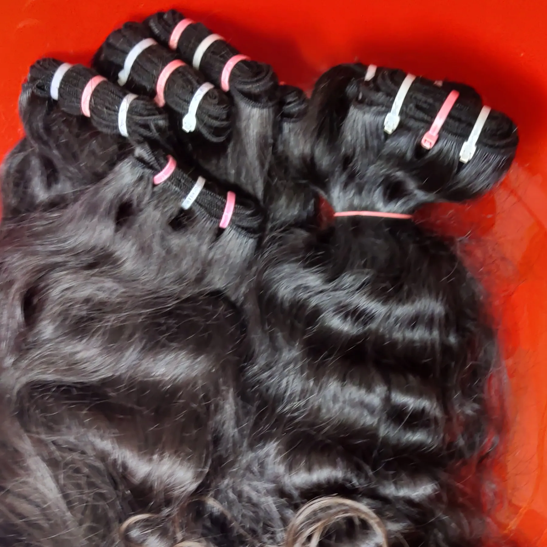 RAW TEMPLE INDIAN HUMAN HAIR IN MACHINE WEFT HAIR EXTENSIONS