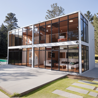 Maison de bureau préfabriquée modulaire de luxe à deux étages avec mur en verre et terrasse