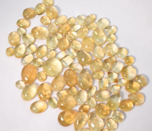 พลอยซิทรินธรรมชาติ คละขนาดและรูปทรง แบบคาโบชอง ขายส่ง ล็อต 635 กะรัต 87 ชิ้น - Product Image 1