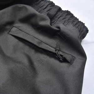 Pantalon de neige noir tendance avec imprimé flamme réfléchissant, matière imperméable, poche cargo, taille à cordon et poignets élastiques pour l'hiver - Product Image 5