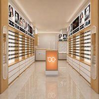 Présentoir mural optique avec fentes pour lunettes rétroéclairées par LED, comptoir de réception incurvé et îlot d'exposition pour magasin de lunettes