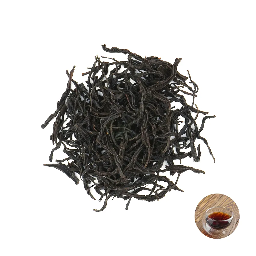 Produk berkualitas danau bulan matahari daun teh hitam menampilkan rasa asli sempurna untuk dibawa dengan kue coklat oranye