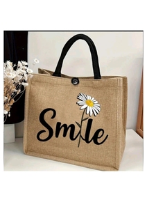 Sac fourre-tout en jute Smile Daisy avec impression graphique et typographique de marguerites en jute naturelle et noire, conçu pour le transport écologique quotidien - Product Image 2