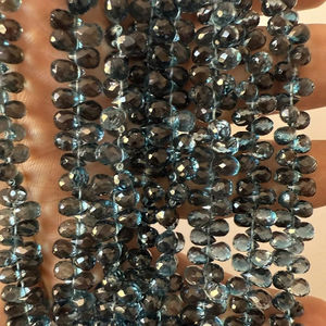 Perles à facettes topaze bleue de Londres naturelle de haute qualité 8 pouces brin ovale goutte pierres en vrac 50 + ans d'expérience Jaipuri Gems - Product Image 1