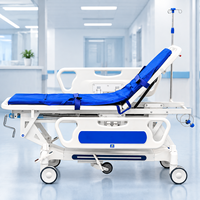 Chariot médical de luxe professionnel en ABS de haute qualité avec système de levage et guide à 5 roues pour les salles d'urgence et de soins intensifs hospitalières