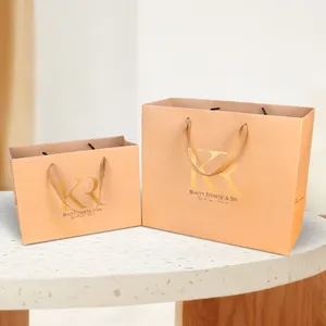 Wholesale Fashion Eco-friendly Kraft Children's Clothes Gift Packaging Bag Brown Gold Hot Stamping Craft Gift Shipping Bag Paper